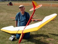 Morris kneeling with his Sky Bird